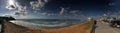 The boardwalk and sandy coast of Tel Aviv